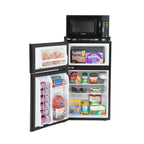 A refrigerator and freezer unit open and full of food with a microwave on top