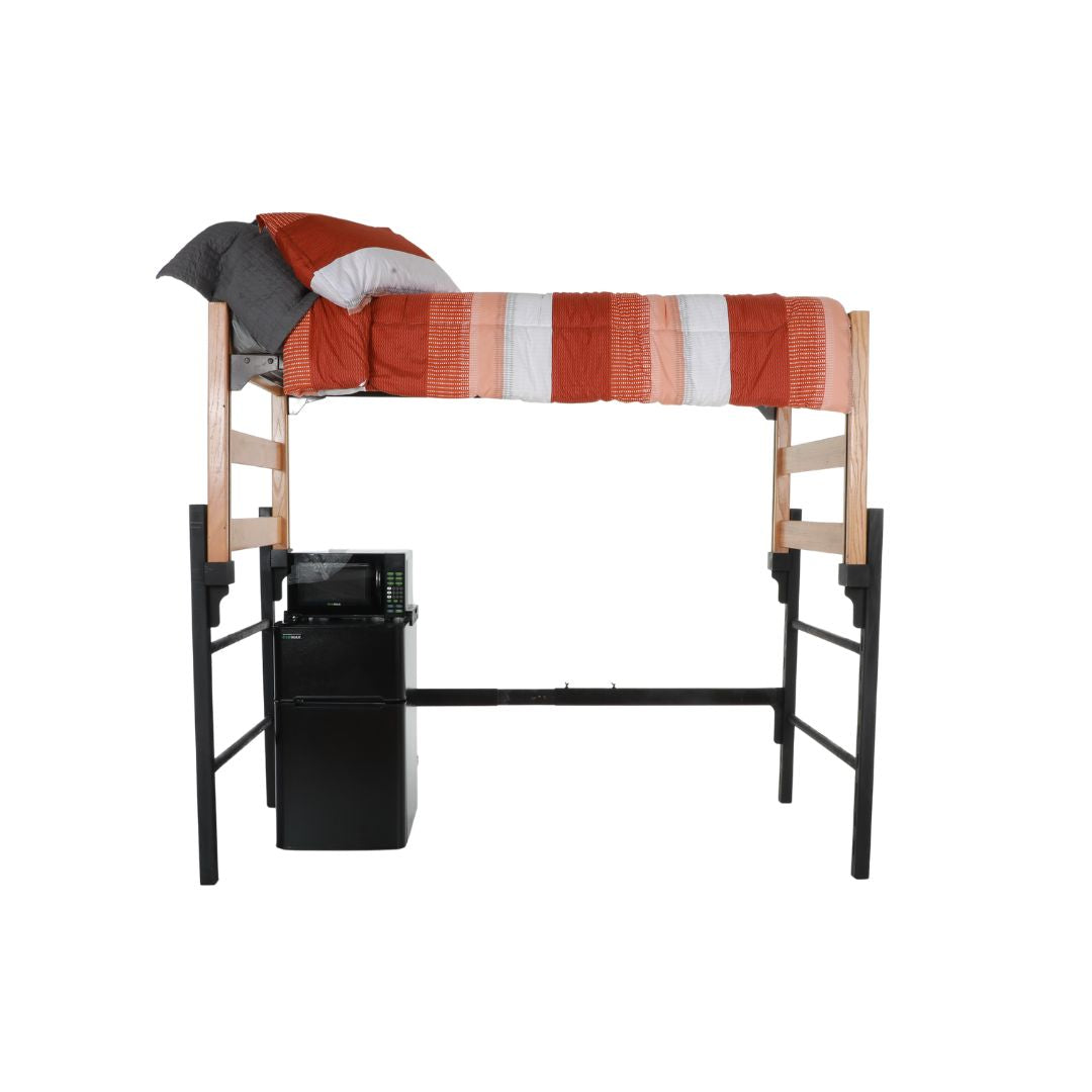 A wooden and metal loft with an orange and white comforter, situated above a refrigerator and freezer unit