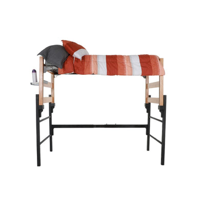 A wooden and metal loft with an orange and white comforter and pop-out shelf