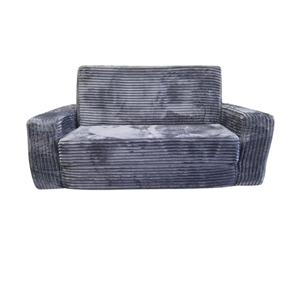 A plush futon in a couch-like position