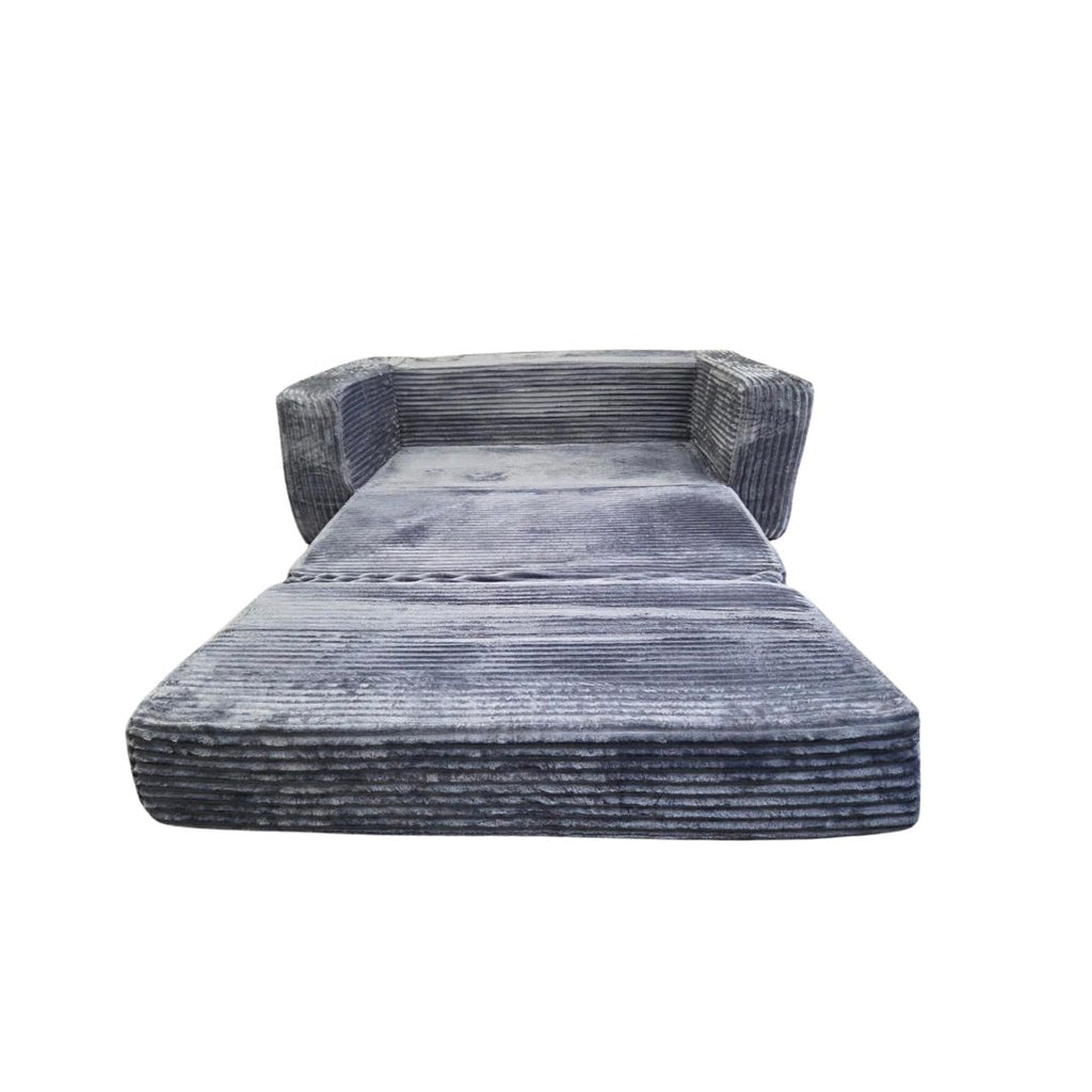 A plush futon in a folded-out, mattress-like position