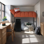 A dorm room setup with a bed loft, desks, and a chair in a grey and orange color palette