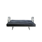 A metal futon in a folded-out, mattress-like position